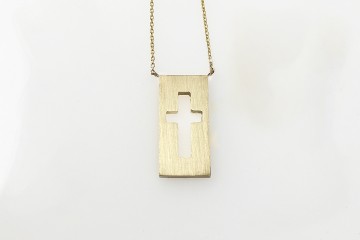 negative space gold cross necklace