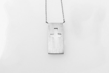 negative space gold cross necklace